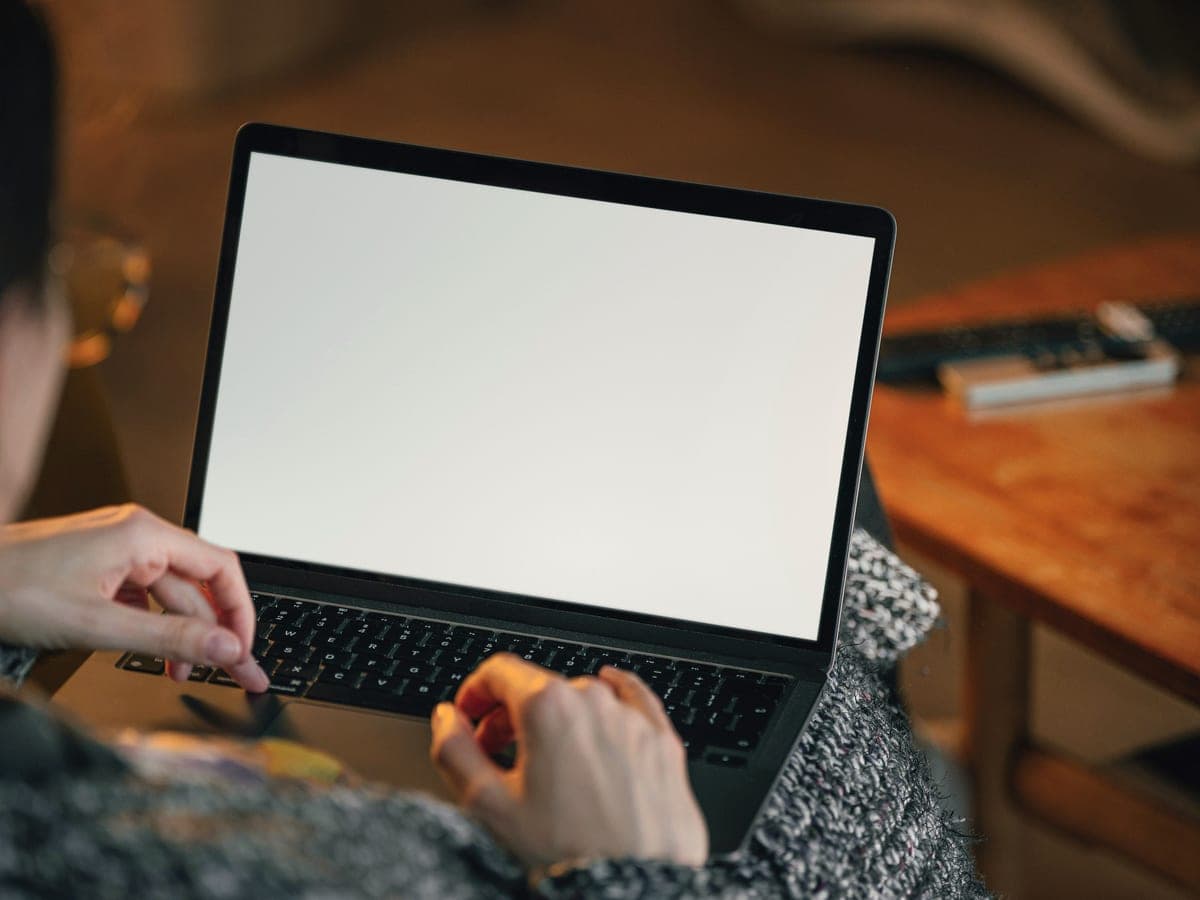 Hands on a laptop