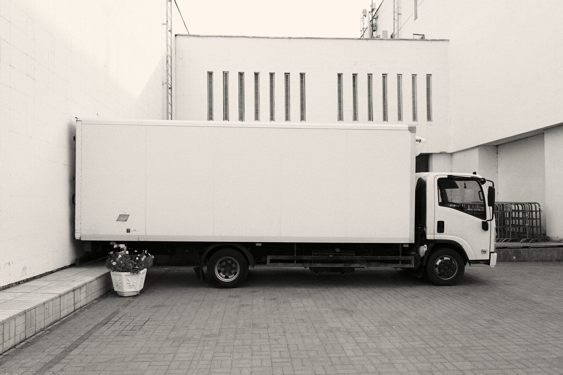 White moving truck parked outside